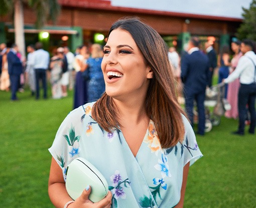 Closeup of wedding guest smiling