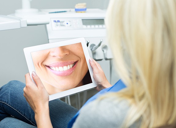 Woman looking smile on tablet computer