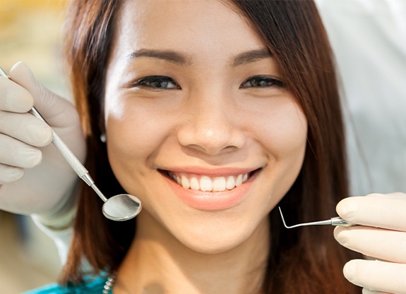 Woman receiving dental exam