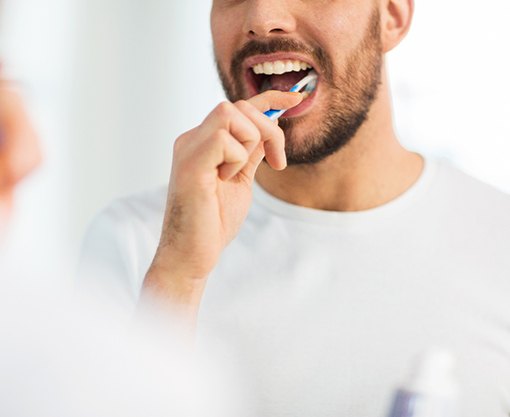 Carmel patient brushing dental implants