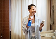 Carmel patient flossing dental implant with water flosser