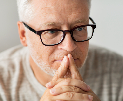 Man with glasses concentrating