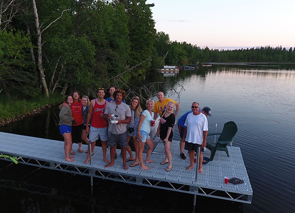 Dr. Springhetti with family and friends on a dock