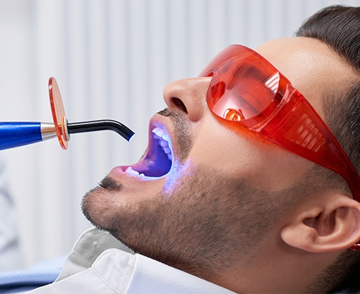 Man receiving dental sealants