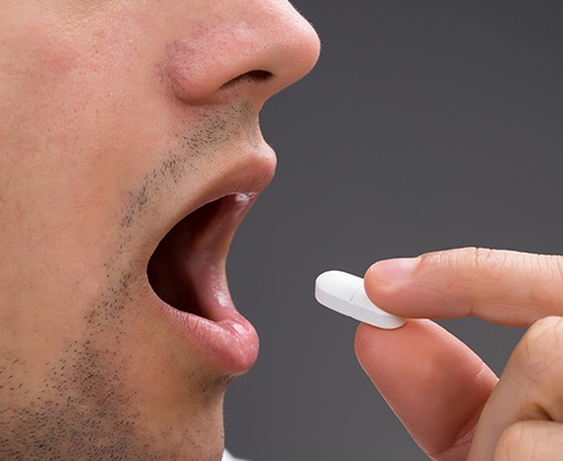 Patient taking oral sedative pill