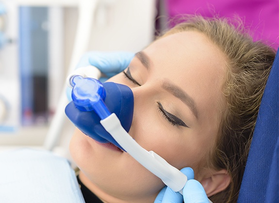 Woman with nitrous oxide nose mask