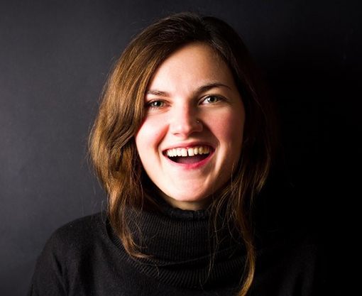 woman in black shirt with gap between front teeth