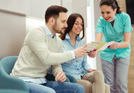 patient in Carmel talking with dentist about financing teeth whitening