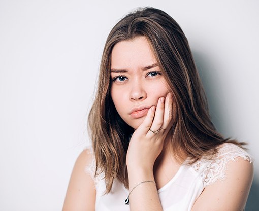 A young woman undergoing a wisdom tooth extraction