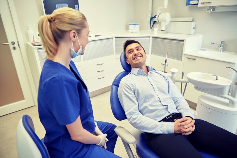 Hygienist with patient at dentist appointment