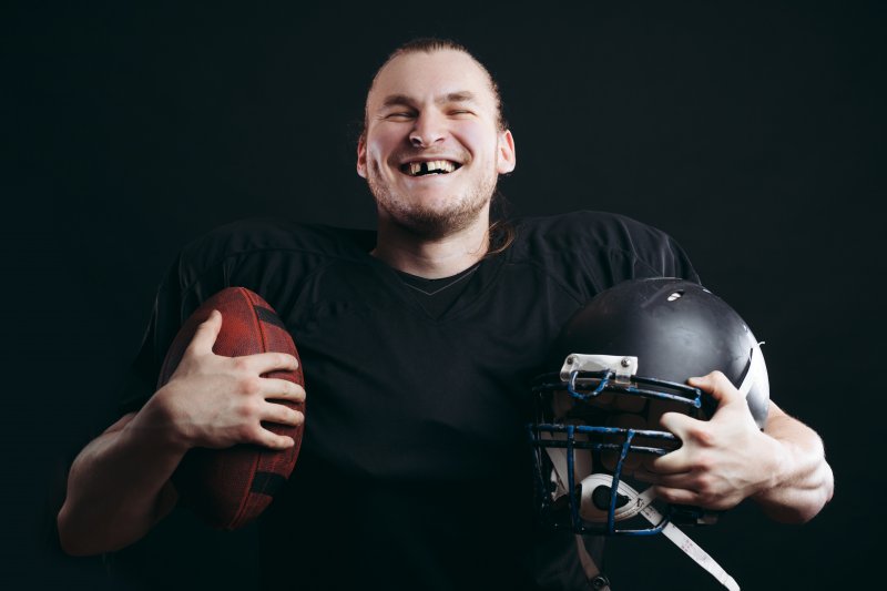 football player with knocked-out tooth in Carmel