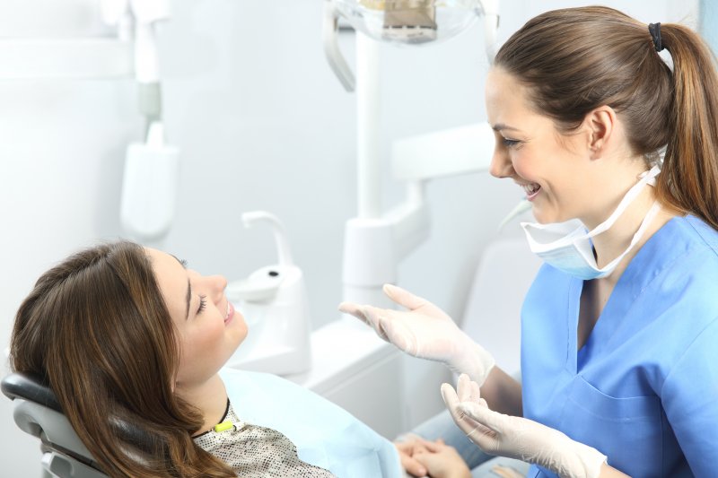 person speaking with cosmetic dentist